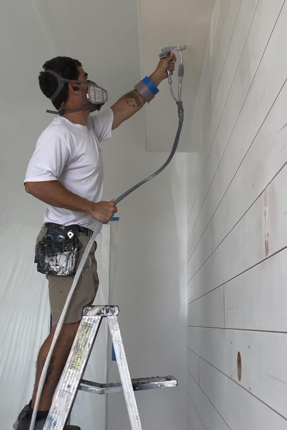 Desmond spraying shiplap