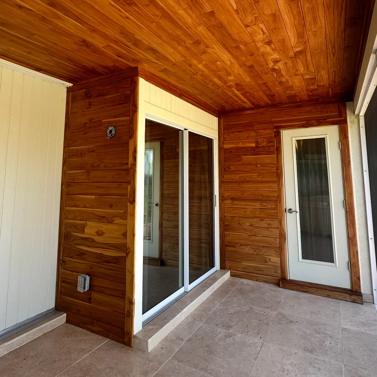 Back patio with toung and groove teak ceiling and walls.