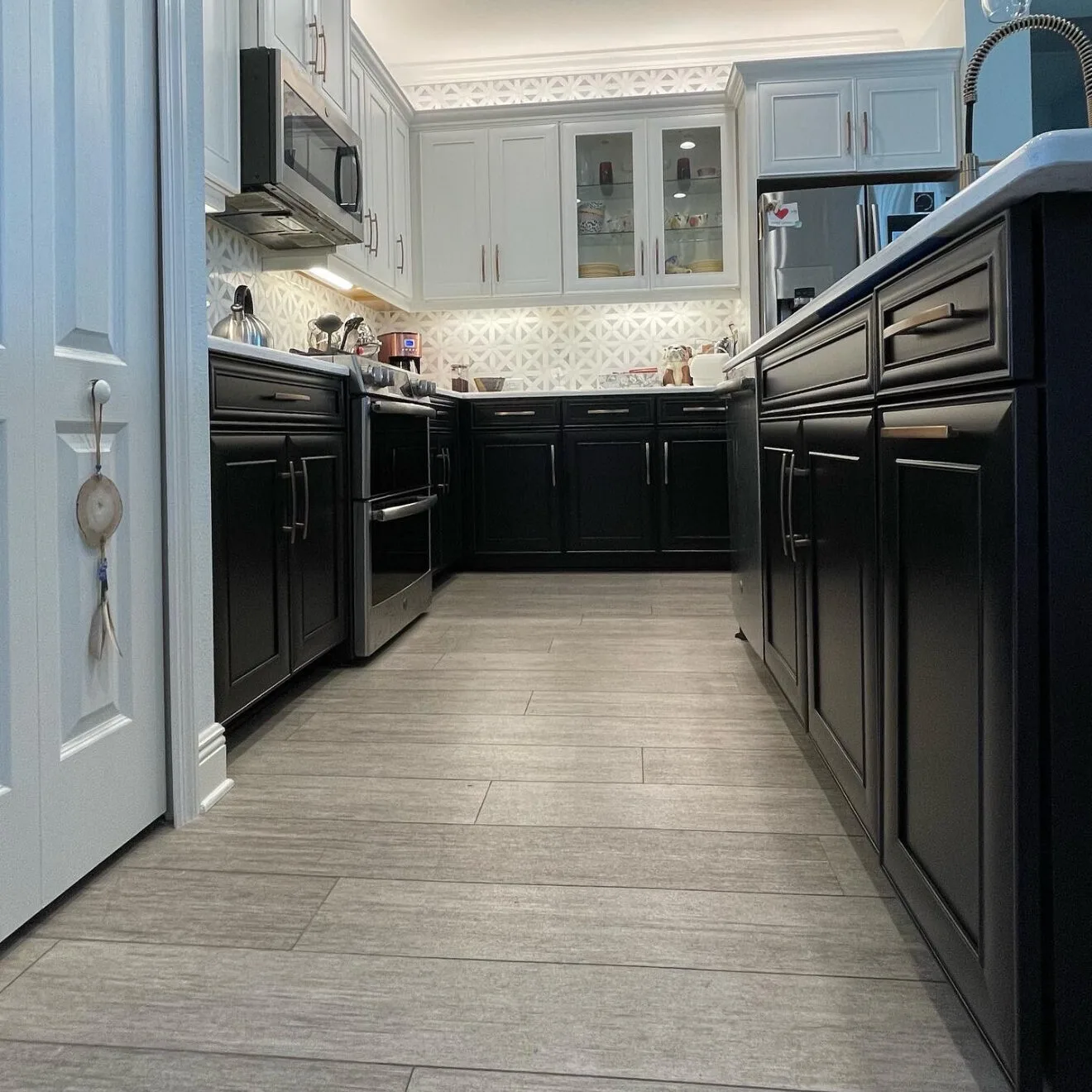 A low perspective of a black and white cabinet paint job