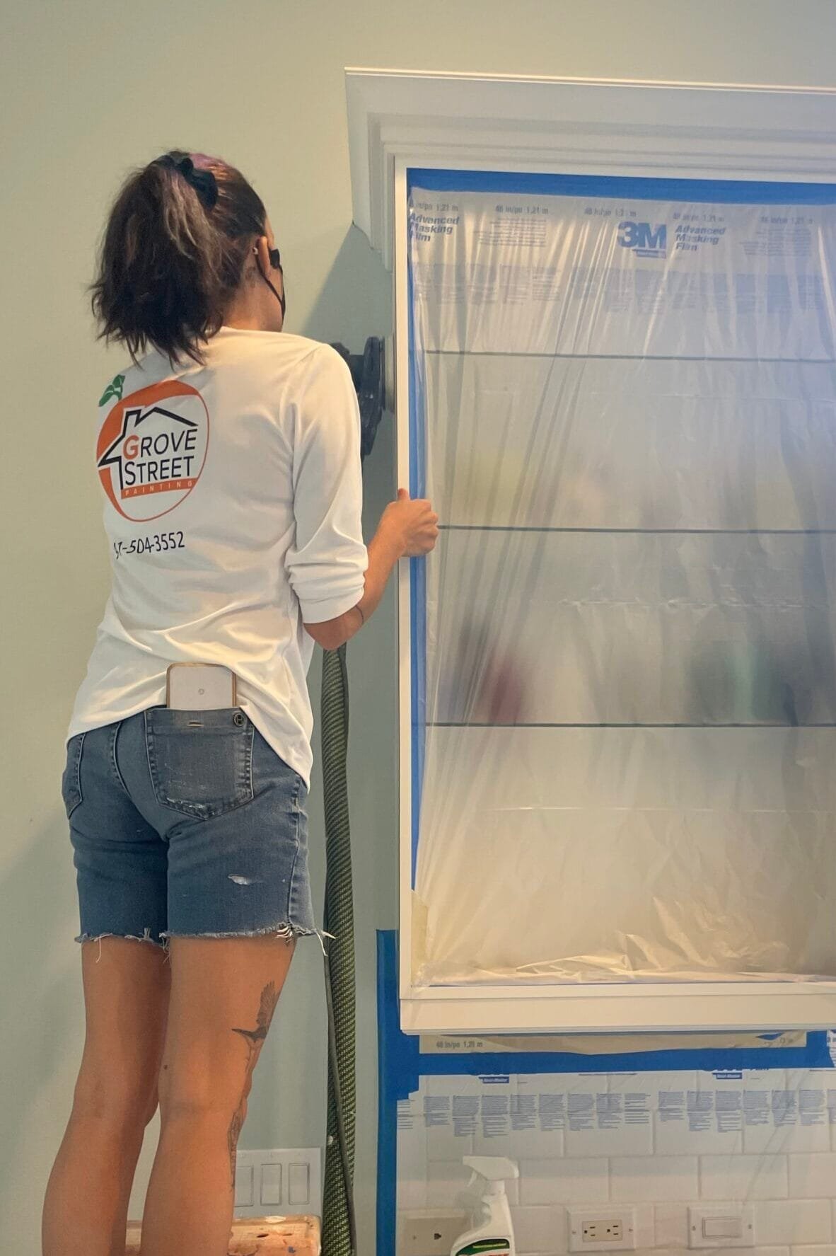 Jaime sanding a cabinet